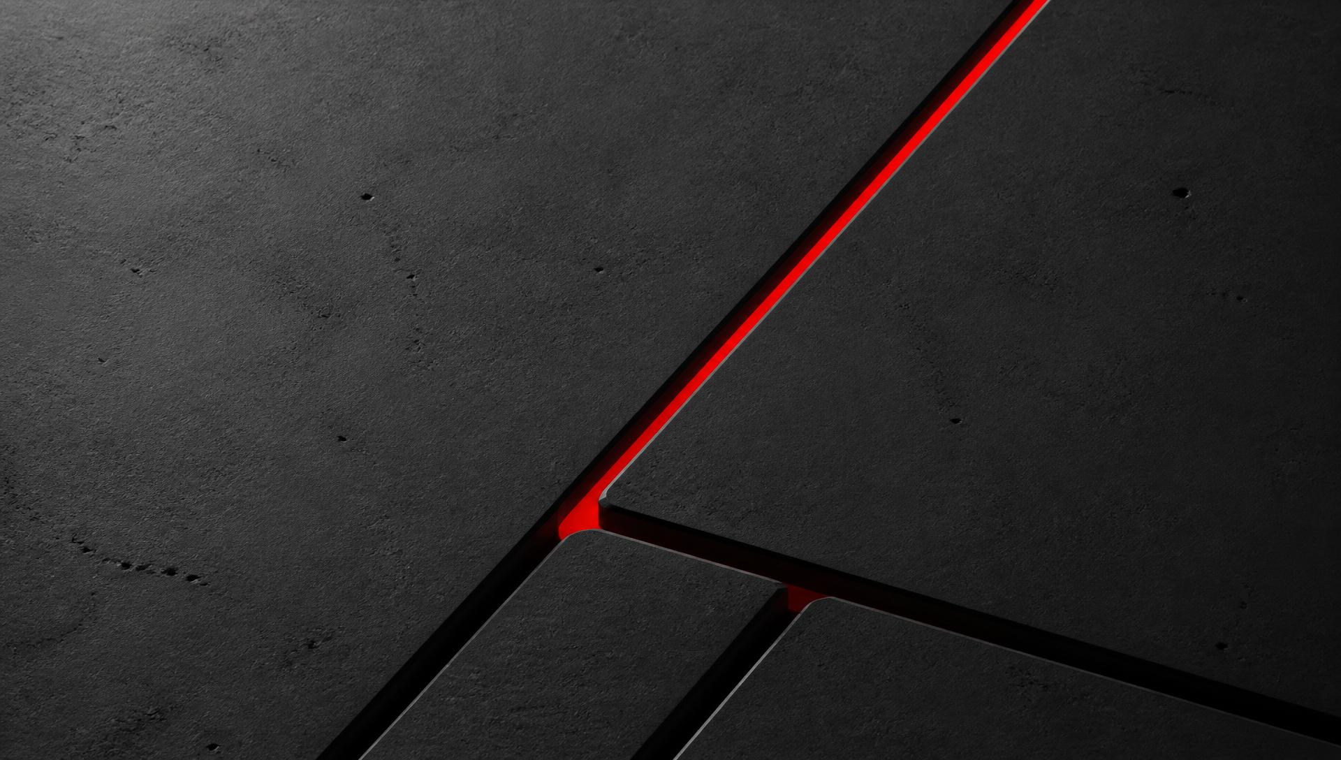 Machined graphite surface with a single glowing line running through it